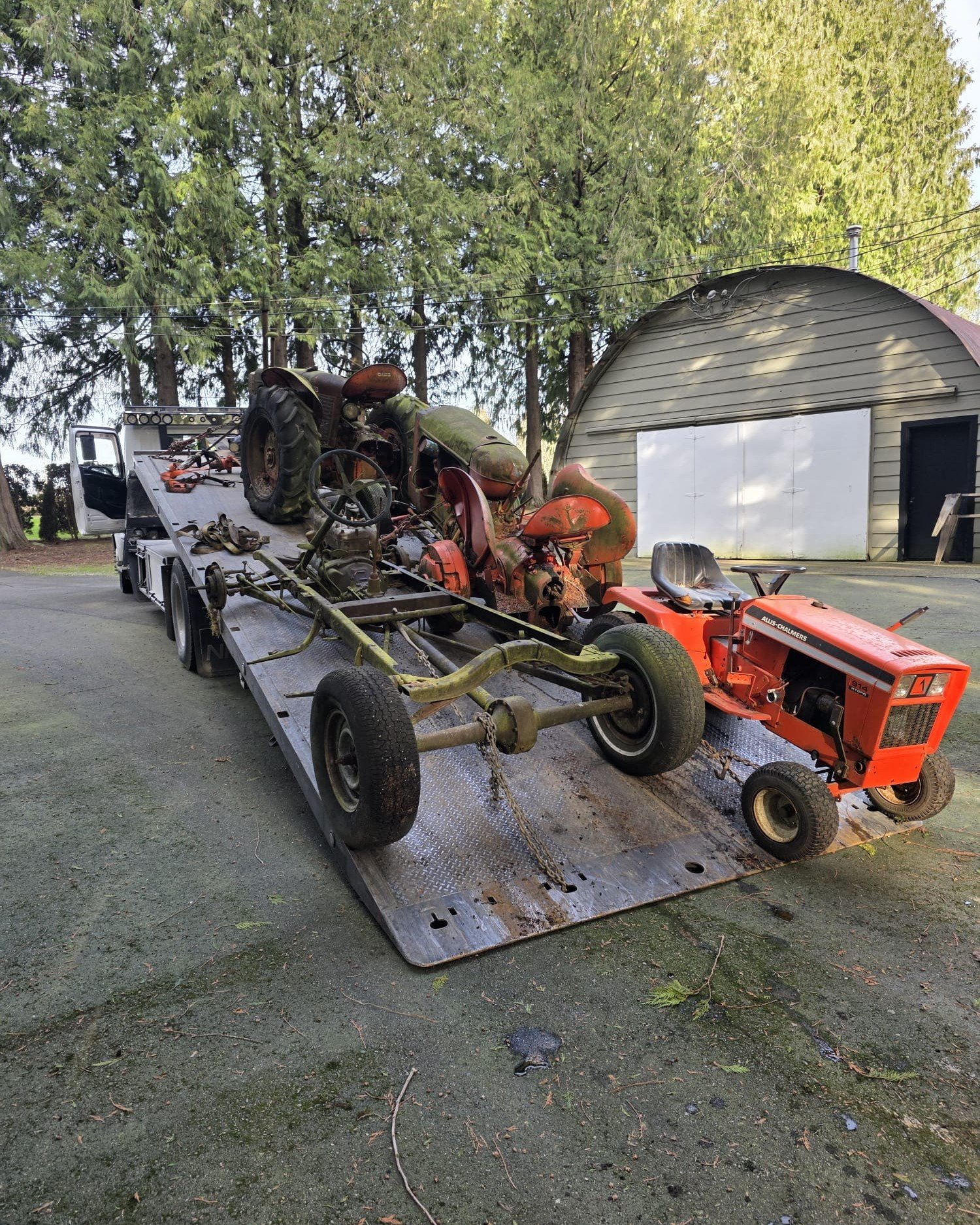 Scrap car removal in Pitt Meadows with a flatbed tow truck