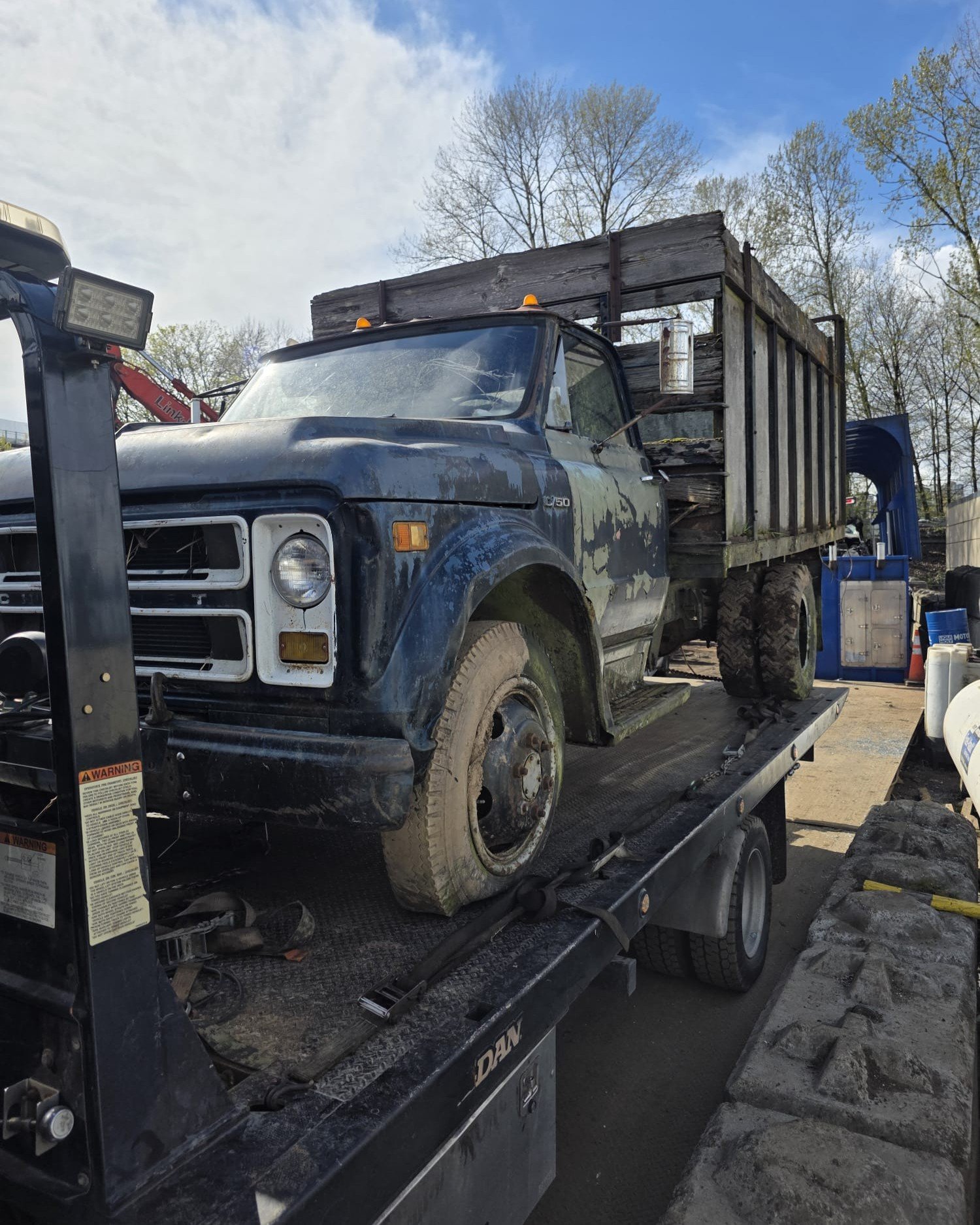 Cash for cars pickup loaded on a flatbed in Pitt Meadows