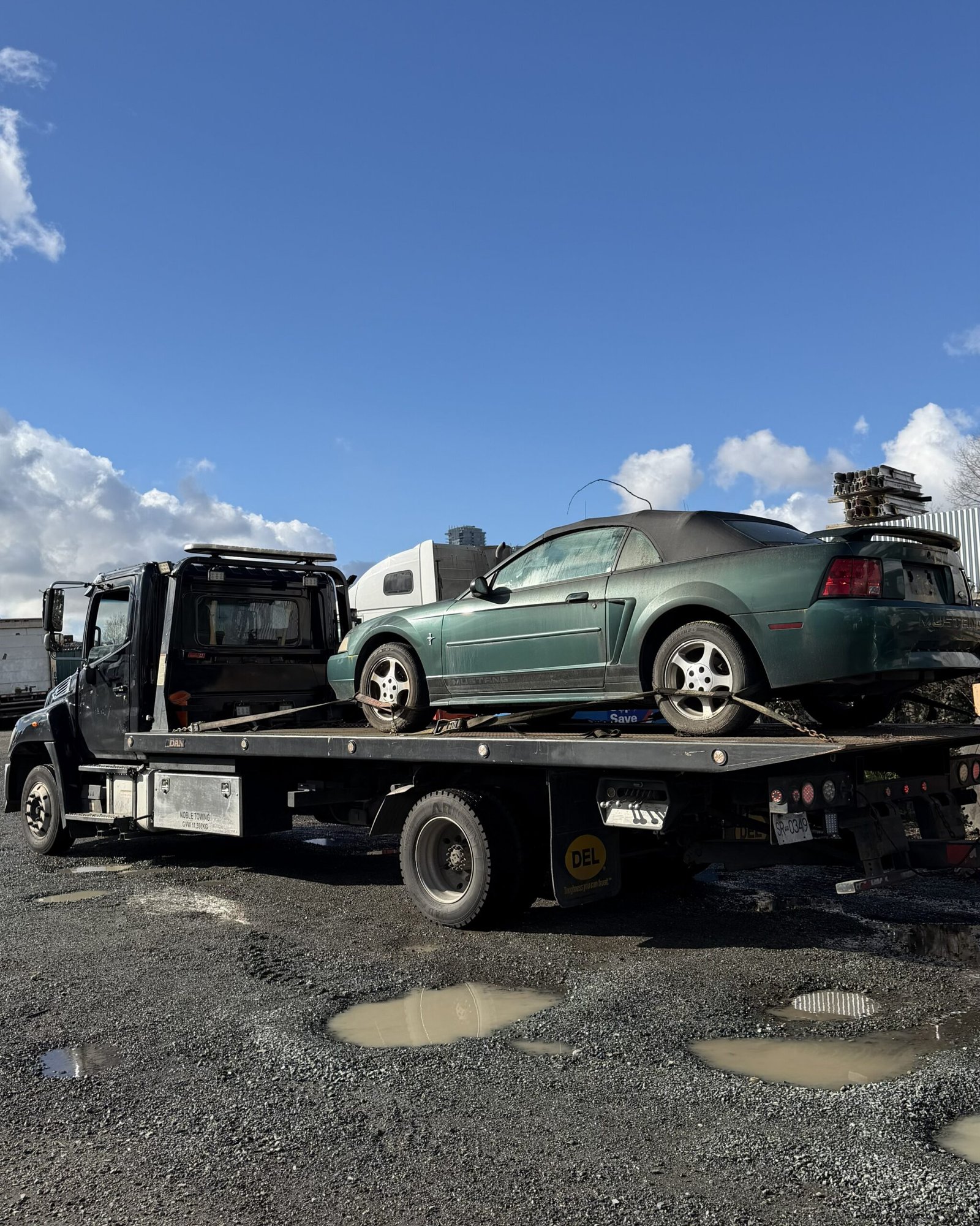 Scrap car being removed from a property in Pitt Meadows